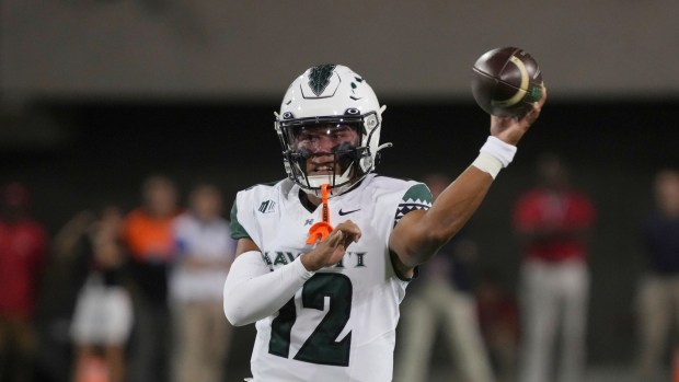 Hawaii quarterback Micah Alejado (12) in the first half during an NCAA football game against Arizona on Saturday, Aug. 30, 2025, in Tucson, Ariz. (AP Photo/Rick Scuteri)