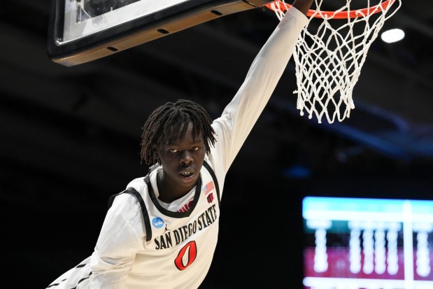 SDSU forward Magoon Gwath dunks during a First Four college basketball game against North Carolina in the NCAA Tournament, Tuesday, March 18, 2025, in Dayton, Ohio. (AP Photo/Jeff Dean)