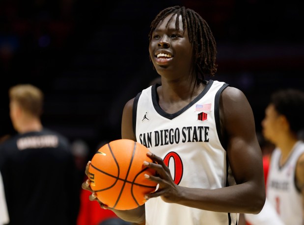 SDSU's Magoon Gwath warms up (but doesn't play) before a game against Idaho State at Viejas Arena on Nov. 9. (K.C. Alfred / The San Diego Union-Tribune)