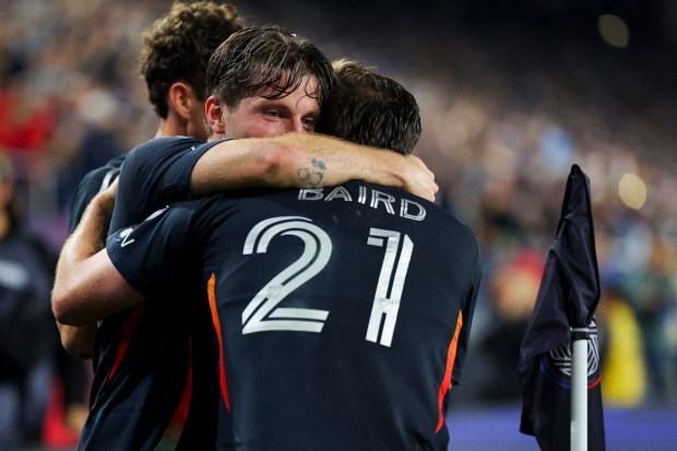Anders Dreyer #10 hugs Corey Baird #21 of San Diego FC after a goal against Minnesota United during the 2025 MLS Cup Playoffs: Conference Semifinals at Snapdragon Stadium on Monday, Nov. 24, 2025 in San Diego, California. (Meg McLaughlin / The San Diego Union-Tribune)
