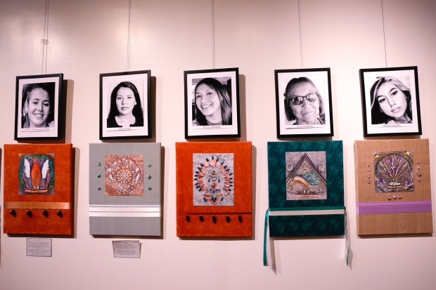 Artist Teyana Viscarra of Chula Vista has created about 50 "Prayer Runs," representing the missing and murdered Indigenous women, which are on exhibit for the "Walking in Beauty: Life as Ceremony" at the Bonita Museum & Cultural Center.   (Nelvin C. Cepeda / The San Diego Union-Tribune)