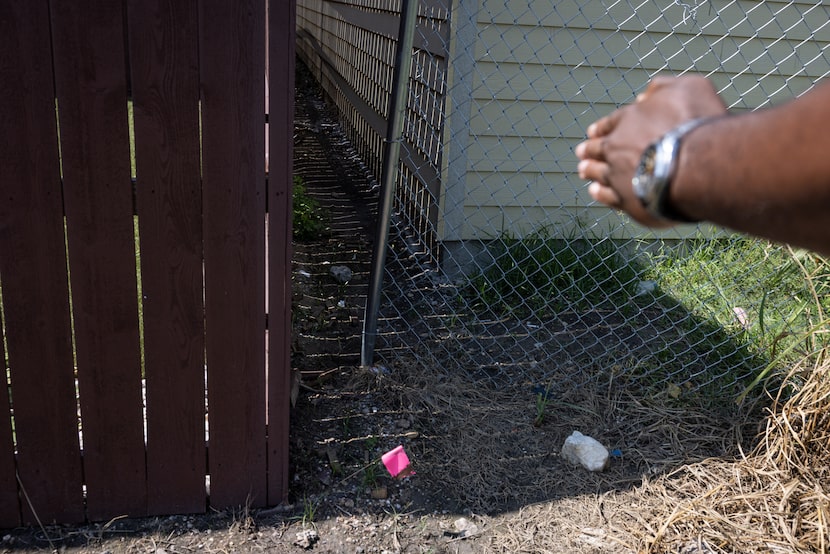 Wesly Bienaime explains that he had to move his backyard fence about 6 inches inward to...