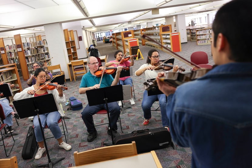 Instructor Andres Alameda conducts a violin class on Wednesday, Oct. 22, 2025, at J. Erik...