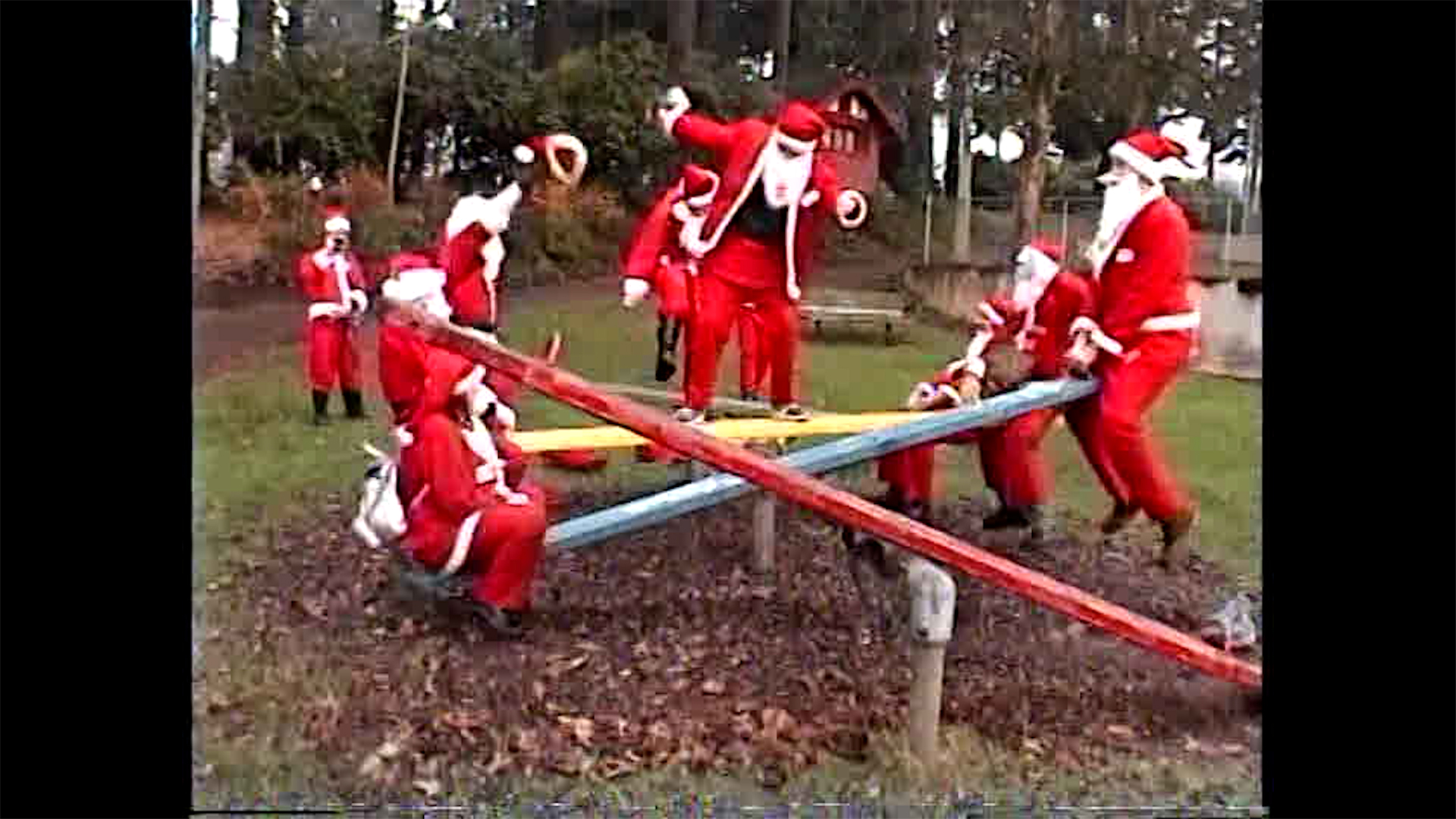 The Santas make a mockery out of a playground in Portland in 1996.