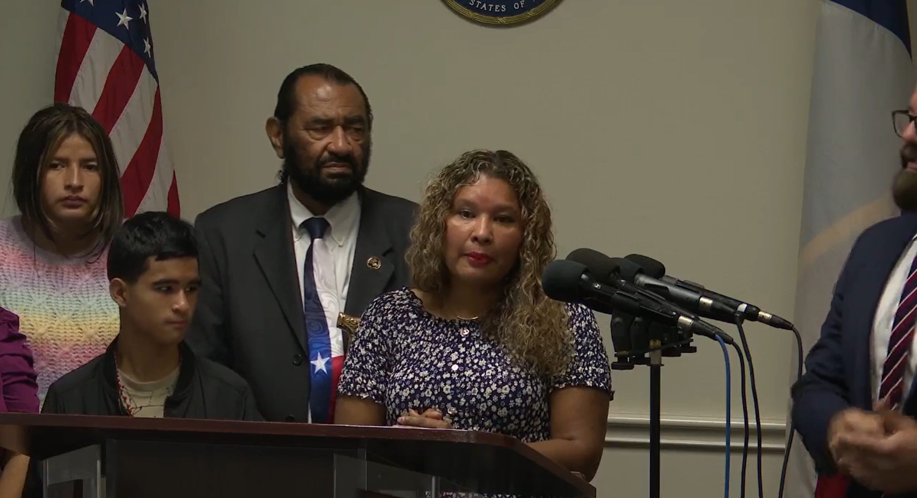 Emmanuel Gonzalez-Garcia, left, watches his mother, Maria Garcia, speak at a press conference with Rep. Al Green on Nov. 24, 2025.