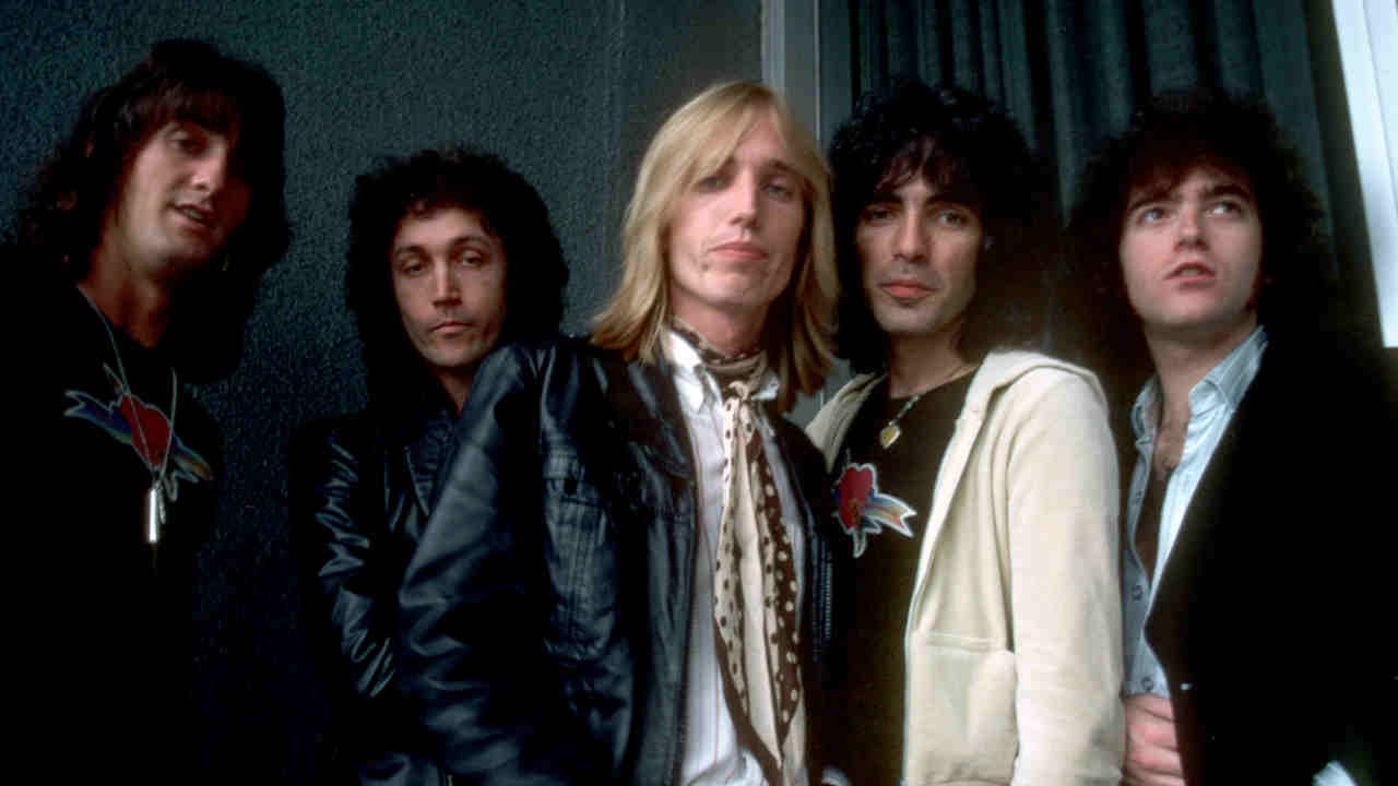 Tom Petty &amp; The Heartbreakers posing for a photograph in 1977