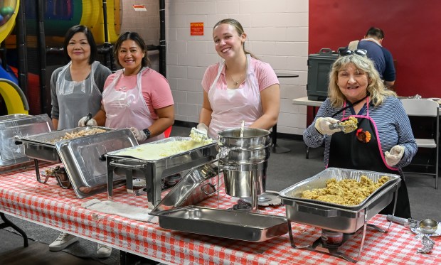 Dozens of volunteers of the Coast Christian Fellowship come together...