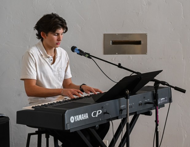 Ben Esponda performs for the guest arrivals at the 27th...