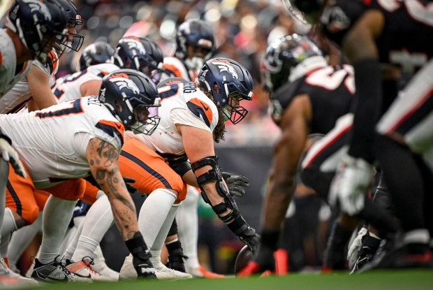 Luke Wattenberg (60) of the Denver Broncos prepares to snap the ball to Bo Nix (10) during the third quarter of the Broncos' 18-15 win over the Houston Texans at NRG Stadium in Houston, Texas on Sunday, Nov. 2, 2025. (Photo by AAron Ontiveroz/The Denver Post)