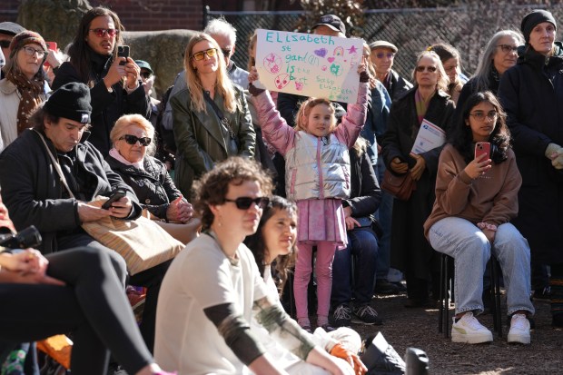 People gather to celebrate Elizabeth Street Garden on April 1, 2025.