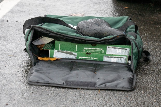 A deliveryman on a bicycle collided with a Lexus at E. 56th St. and Linden Blvd. in East Flatbush, Brooklyn, on Friday, Nov. 21, 2025. (Theodore Parisienne / New York Daily News)