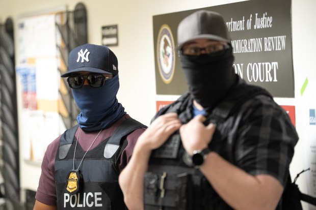 Federal law enforcement officers are pictured outside immigration courtrooms at the Jacob K. Javits Federal Building on Friday, Nov. 21, 2025 in Manhattan, New York. (Barry Williams/ New York Daily News)