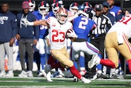 San Francisco 49ers running back Christian McCaffrey (23) rushes with he ball during an NFL...