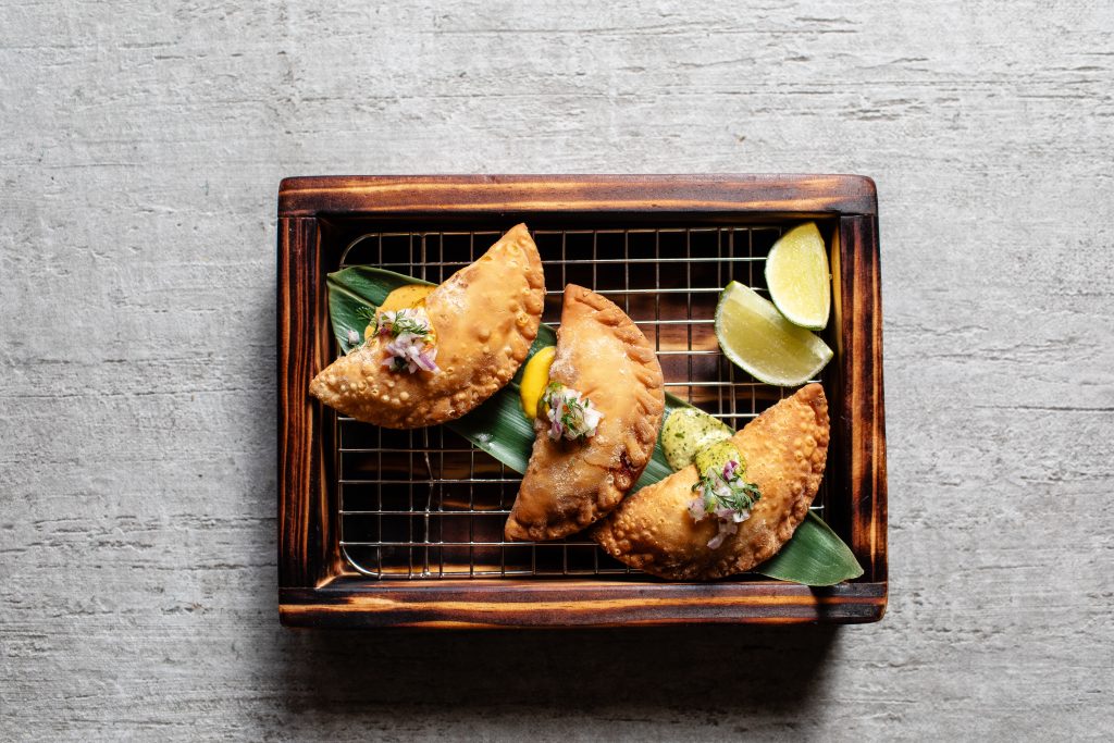 Tanta's empanada sampler features beef tenderloin, shredded chicken and chille, and corn and queso fresco fillings.