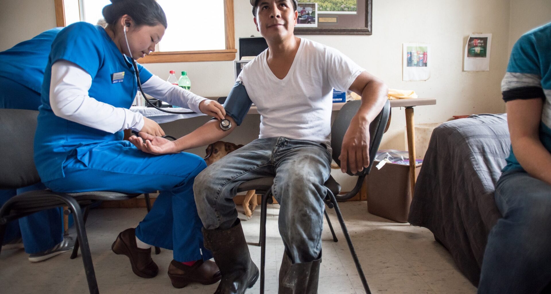 Roberto Tecpile gets his blood pressure checked