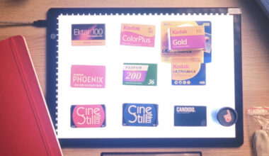 A lightbox displays various 35mm film boxes and labels, including Kodak Ektar 100, ColorPlus, Gold, Ultramax, Fujifilm 200, Ferrania P30, CineStill, and CANDIDO. A red notebook and plastic bag are nearby.
