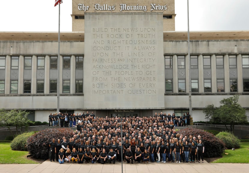 The Dallas Morning News staff group photo in front of the Rock of Truth, photographed April...
