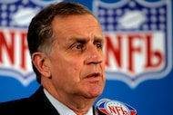 FILE - This May 23, 2006 file photo shows then NFL Commissioner Paul Tagliabue responding to...