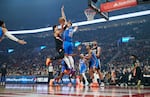 Portland Trail Blazers forward Deni Avdija, left, shoots over Oklahoma City Thunder center Isaiah Hartenstein during the first half of an NBA basketball game in Portland, Ore., Wednesday, Nov. 5, 2025.