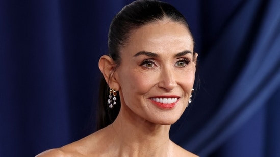 Demi Moore's beauty routine focuses on gentle, fragrance-free cleansing and skincare, combined with the use of facial sculpting tools like gua sha and facials.(AFP)