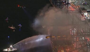 First responders battling a blaze on a container ship docked at the Port of Los Angeles on Nov. 21 in Los Angeles.