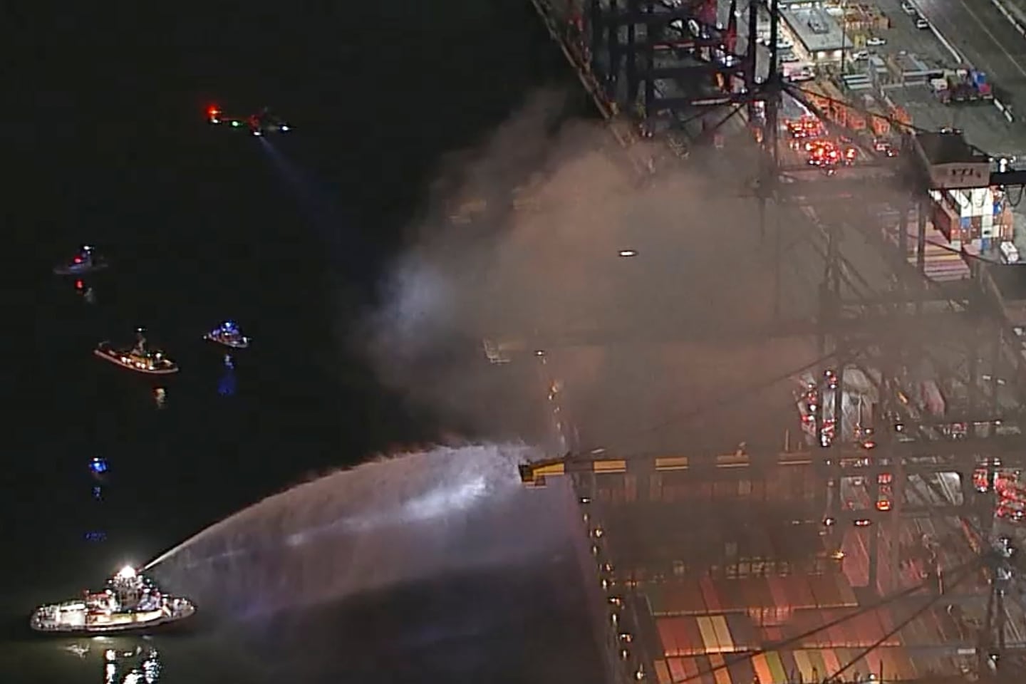 First responders battling a blaze on a container ship docked at the Port of Los Angeles on Nov. 21 in Los Angeles.