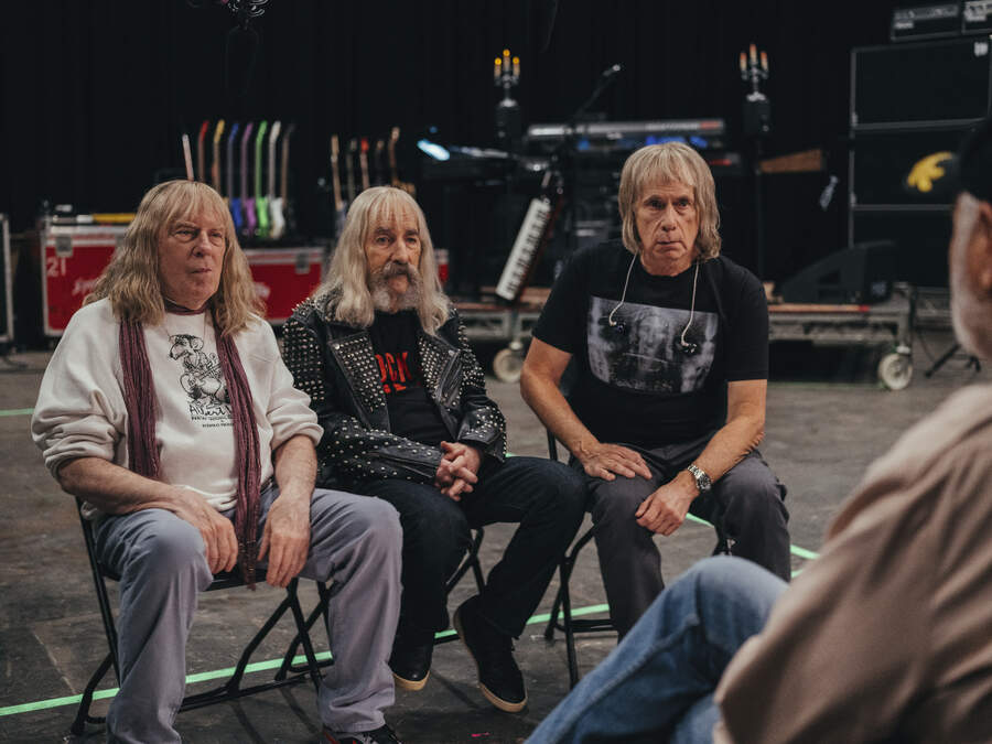 David St Hubbins, Derek Smalls and Nigel Tufnel being interviewed