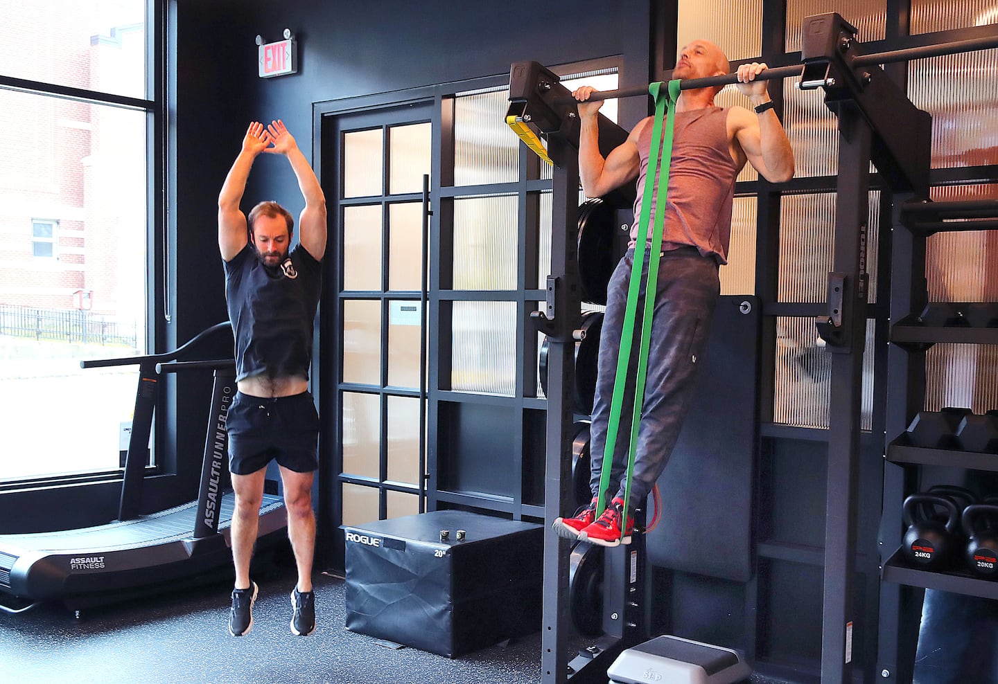 Adam Sandel (left) and Ron Cooper warmed up at Underground Fitness.