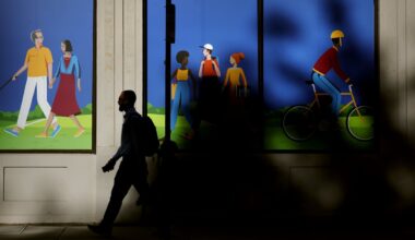 A pedestrian passed through Post Office Square on Congress Street in Boston.