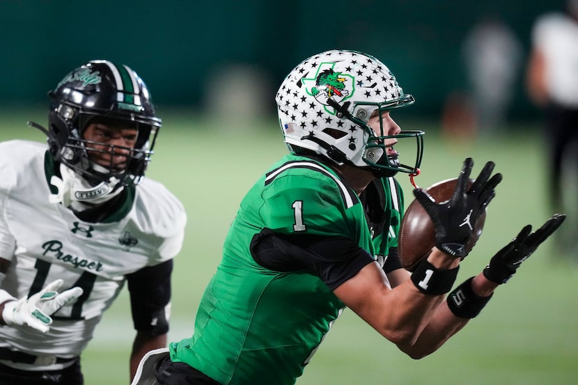 Southlake Carroll wide receiver Brock Boyd (1) catches a pass as Prosper’s Trevor Ellis (11)...