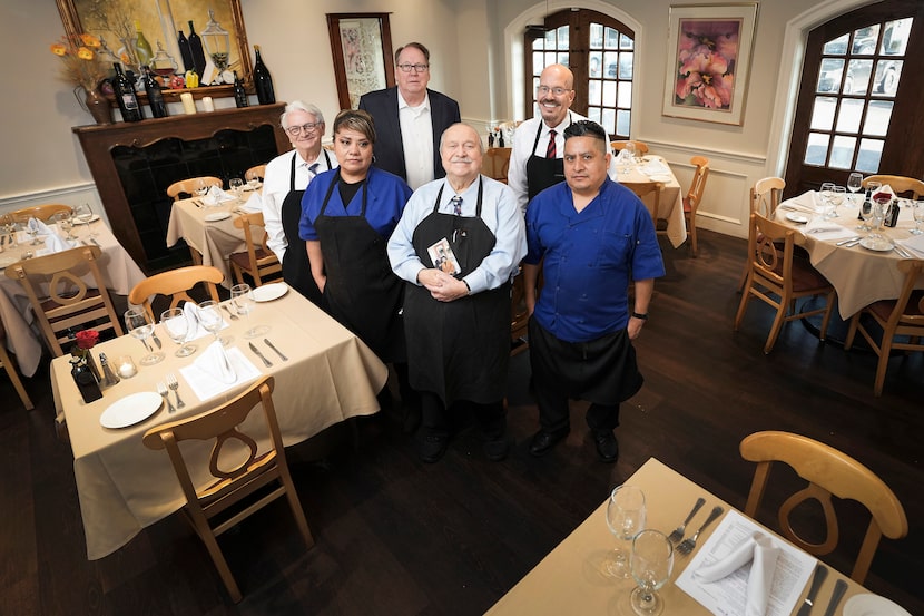 Adelmo Banchetti  (at center) and his team serve Italian food at a Dallas restaurant near...