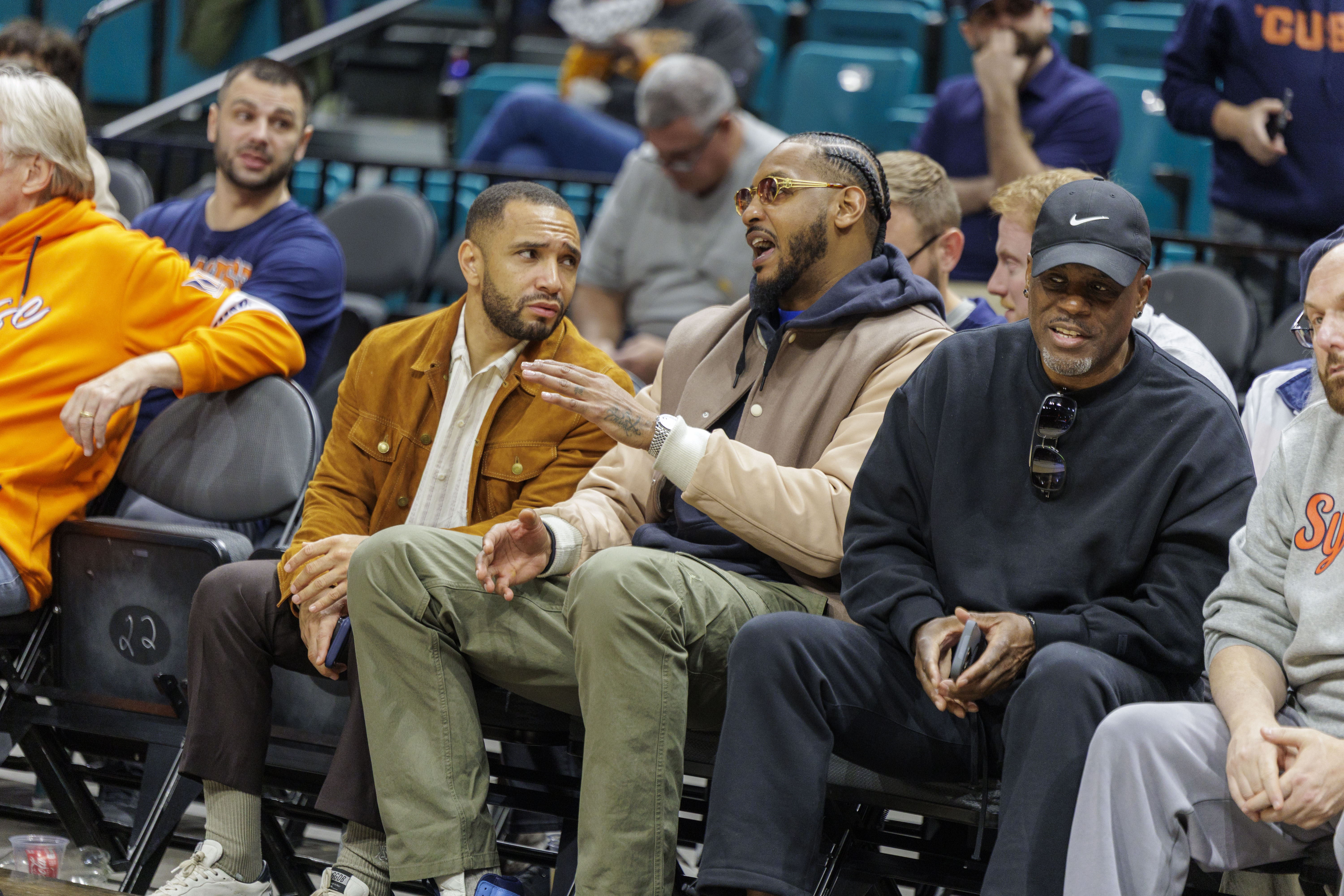 Carmelo Anthony sits curtsied to watch his son Syracuse Orange forward Kiyan Anthony (7) and the Orange as Syracuse takes on Houston in the first round of play in the Players Era Festival at the MGM Grand in Las Vegas Monday, November 24, 2025. (N. Scott Trimble | strimble@syracuse.com)