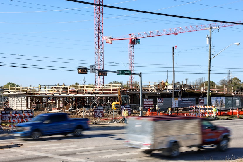Traffic move along S. Buckner Blvd as a construction of an apartment complex is seen, on...