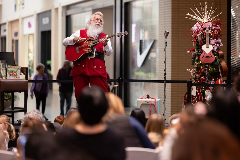 Joel Lagrone, a former aerospace engineer and longtime singer, performs as Santa at the...