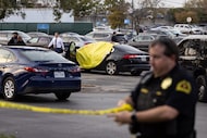Dallas Police block off a WalMart parking lot after a reported shooting on Wednesday, Nov....