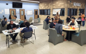 Families eating Thanksgiving meal