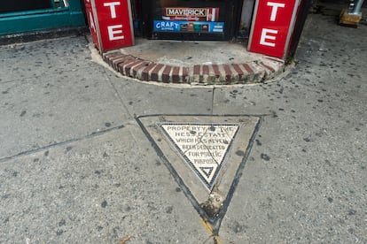 The Hess Triangle, on the sidewalk in front of Village Cigars, in the West Village.