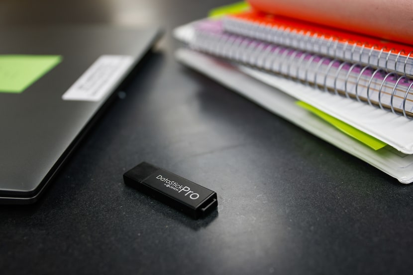 A flash drive holding case files is given to each group of the UT-Arlington Forensic...