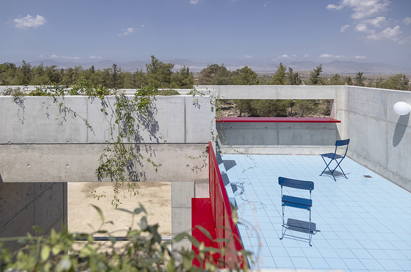 vertical cuts split monolithic 'cube within a cube' suburban residence in cyprus