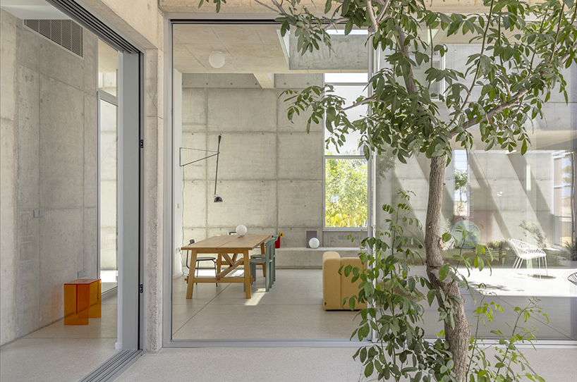 vertical cuts split monolithic 'cube within a cube' suburban residence in cyprus