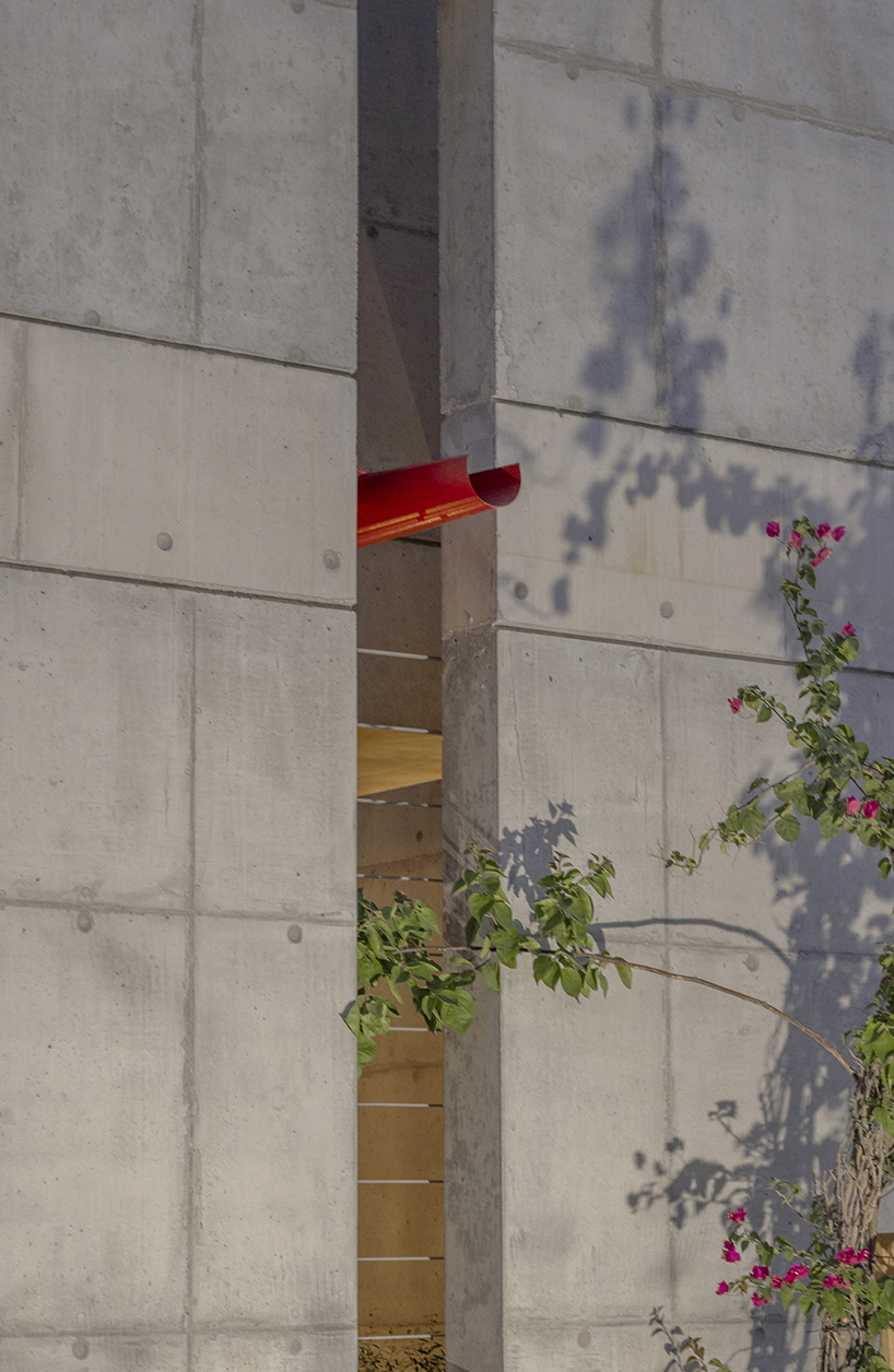 vertical cuts split monolithic 'cube within a cube' suburban residence in cyprus