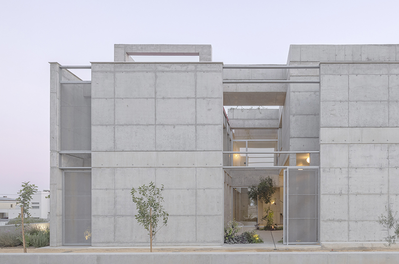 vertical cuts split monolithic 'cube within a cube' suburban residence in cyprus