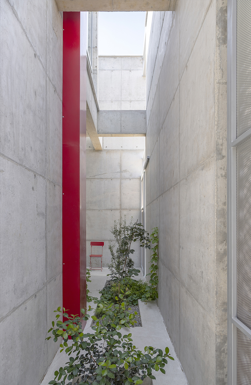 vertical cuts split monolithic 'cube within a cube' suburban residence in cyprus