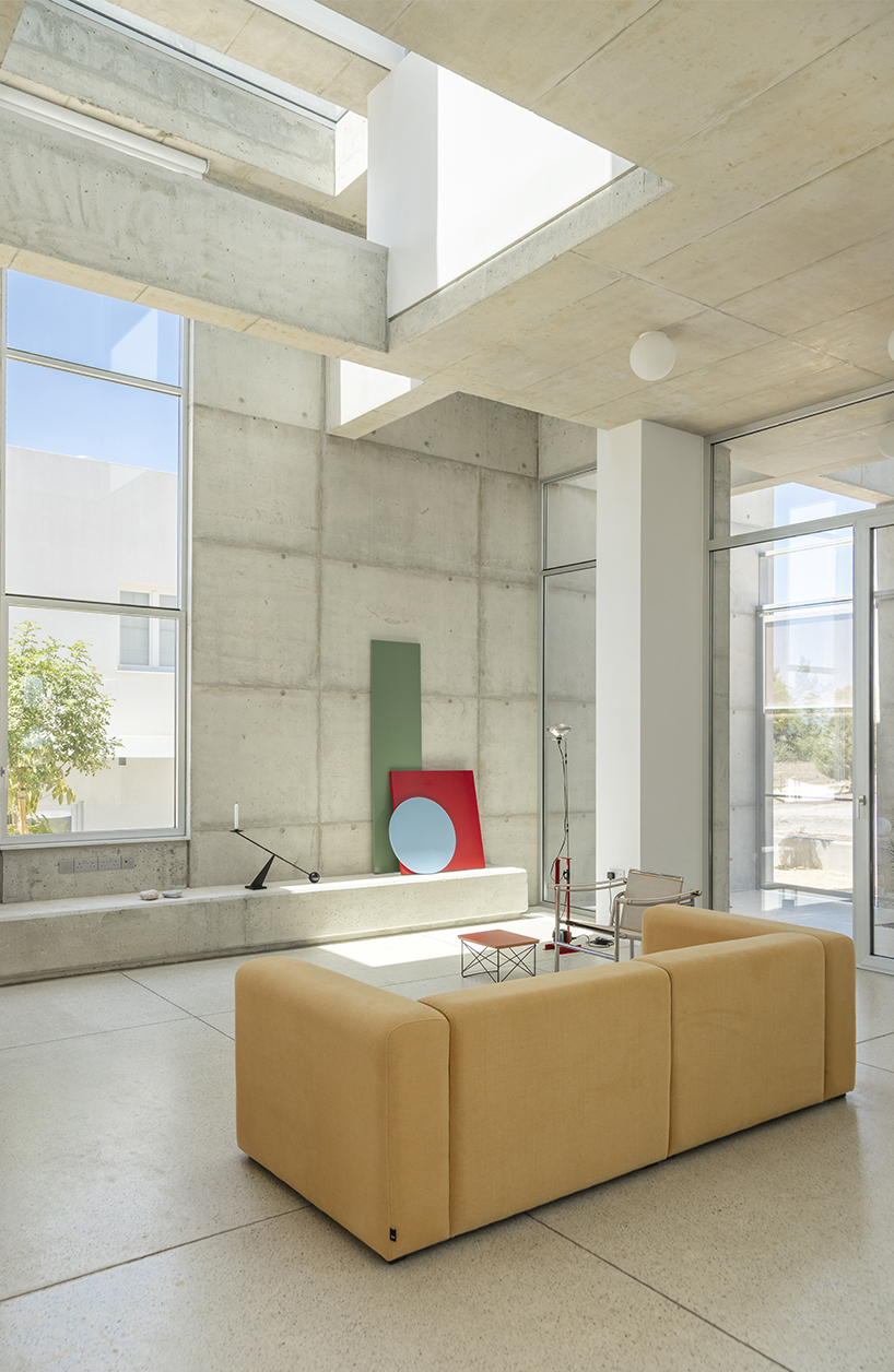 vertical cuts split monolithic 'cube within a cube' suburban residence in cyprus