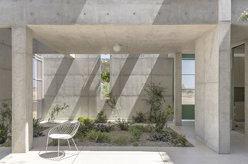 vertical cuts split monolithic 'cube within a cube' suburban residence in cyprus