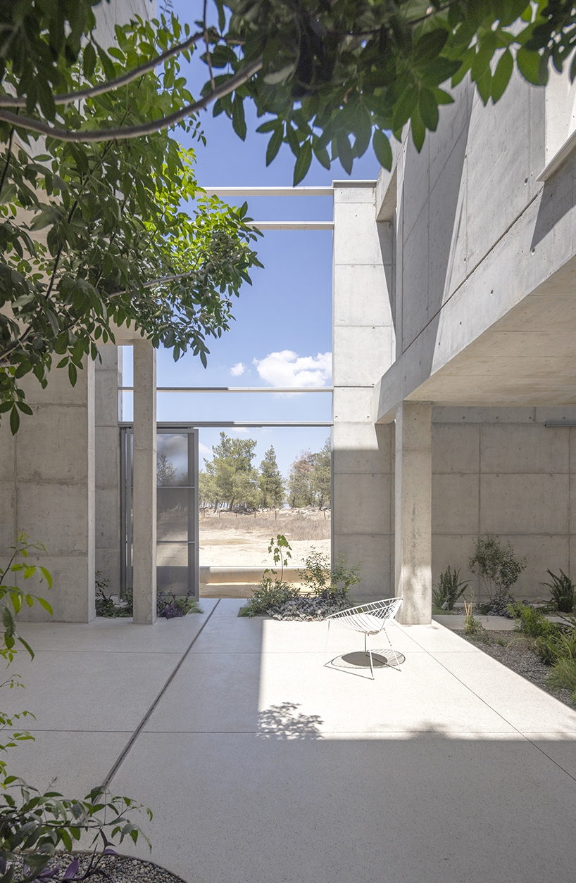 vertical cuts split monolithic 'cube within a cube' suburban residence in cyprus