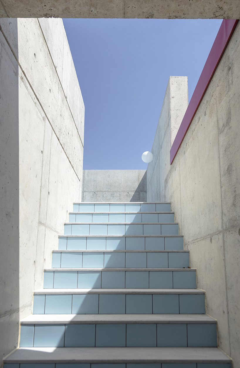 vertical cuts split monolithic 'cube within a cube' suburban residence in cyprus