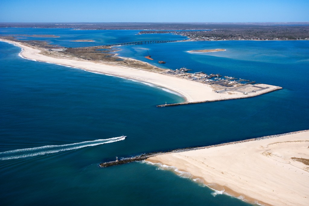 Aerial view of a boat entering Shinnecock Bay in New York.