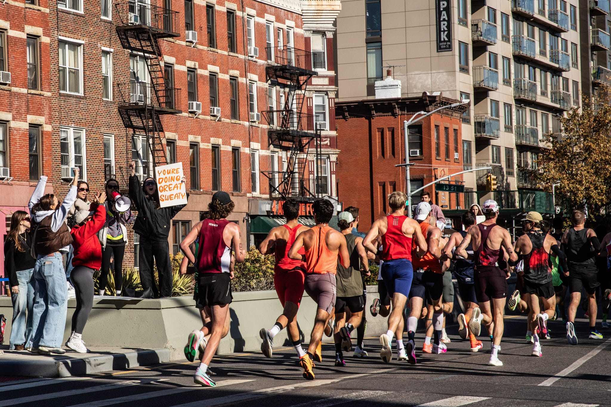 runners in a marathon on city streets runners in a marathon on city streets