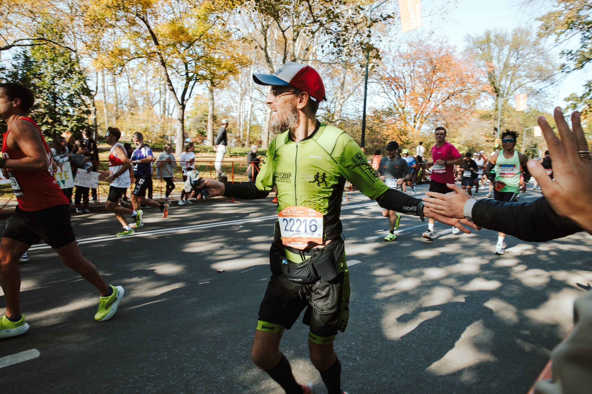 runners in a marathon on city streets runners in a marathon on city streets